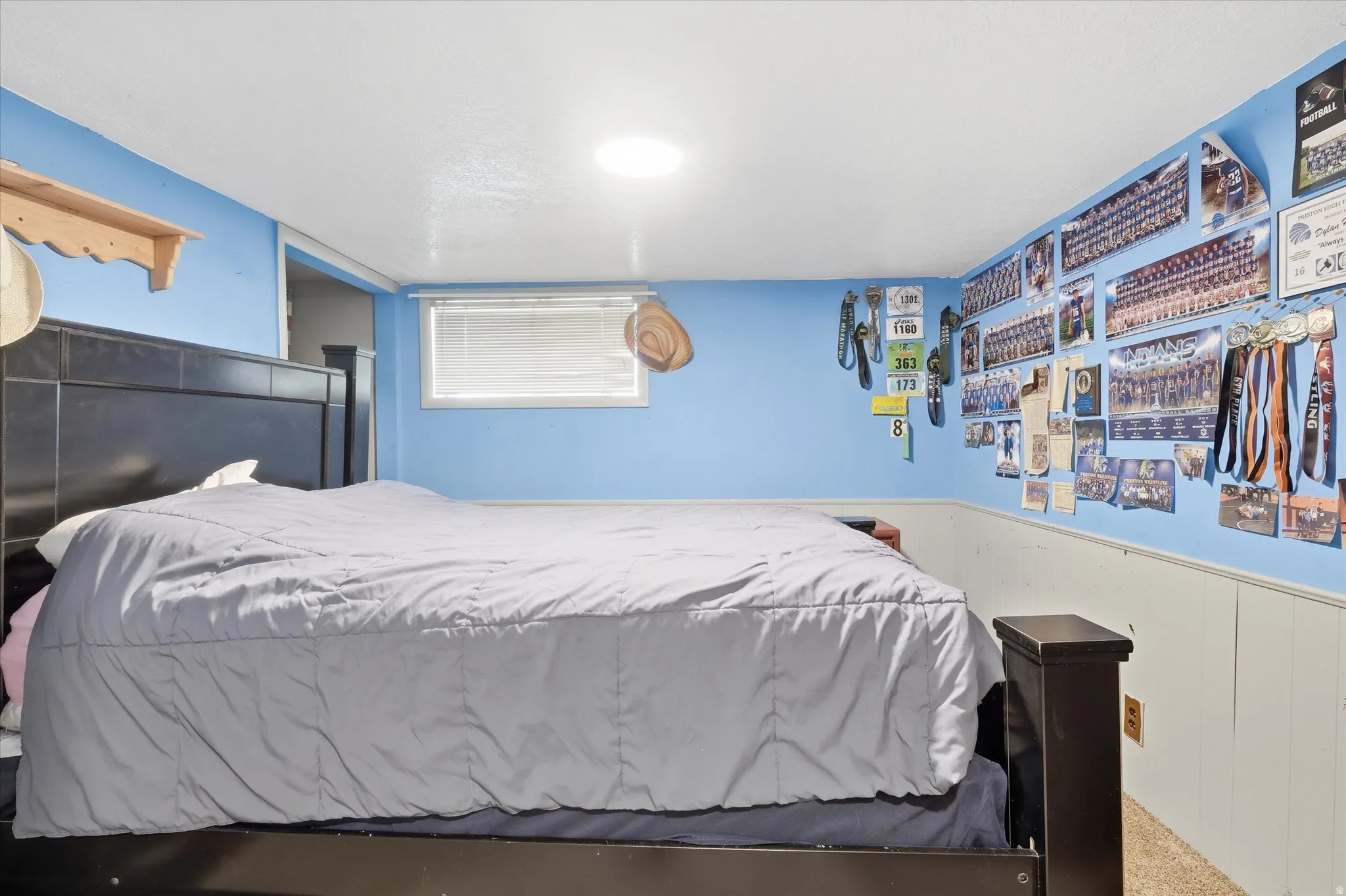 Bedroom 1 in basement with wainscoting