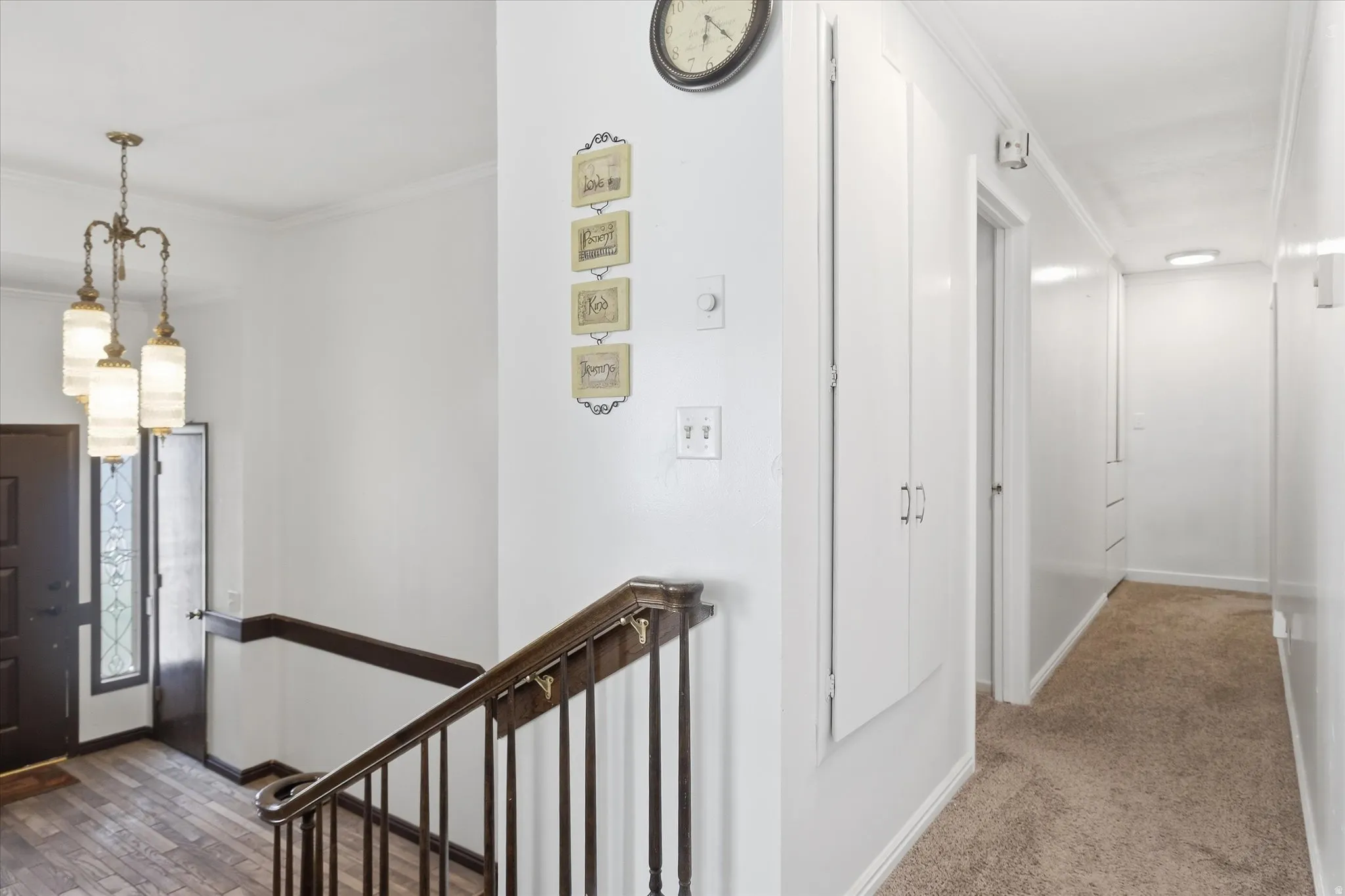 Entrance foyer featuring ornamental molding