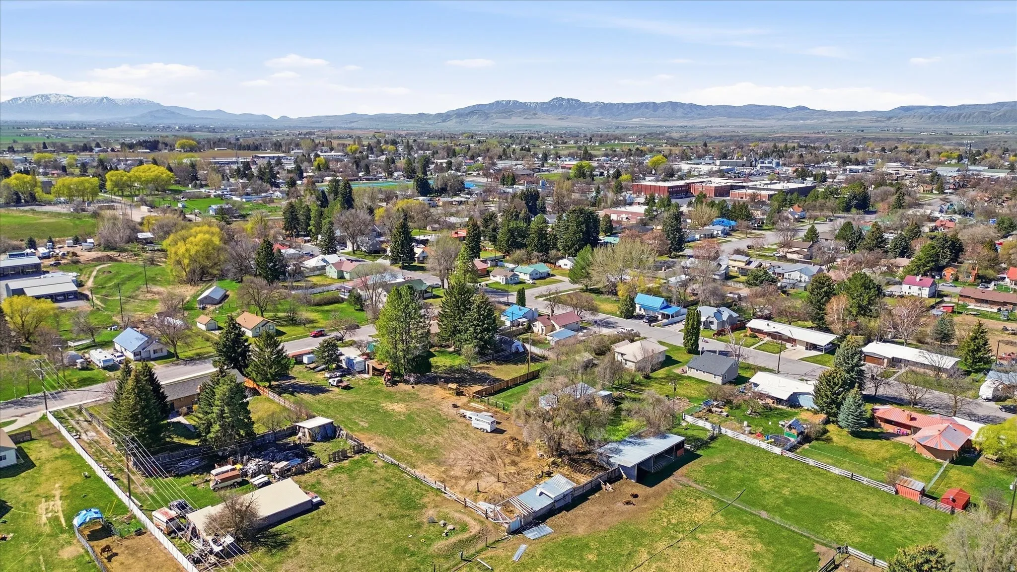 Aerial perspective of suburban area featuring a mountainous background