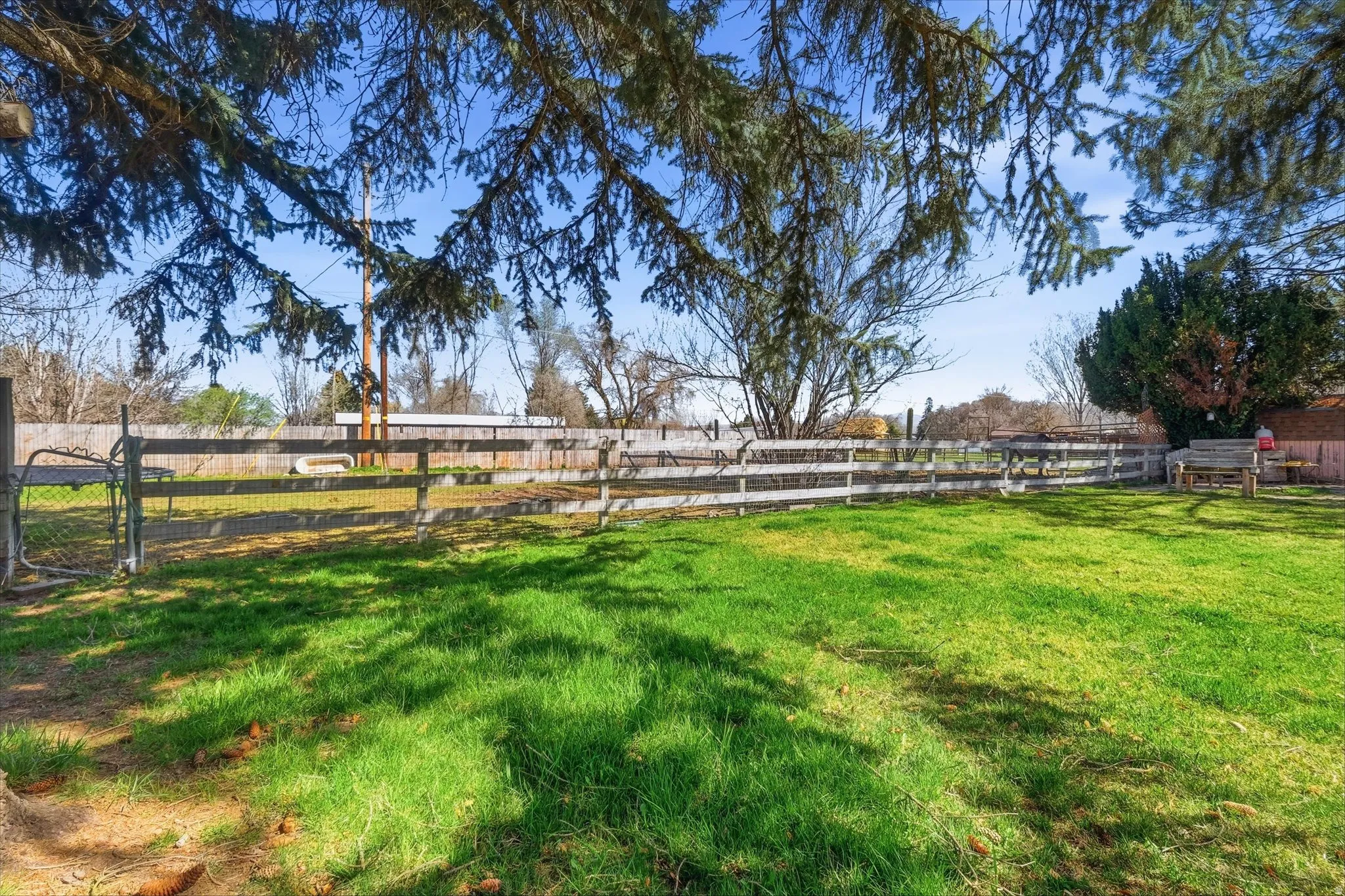 View of yard featuring a view of countryside and a gate