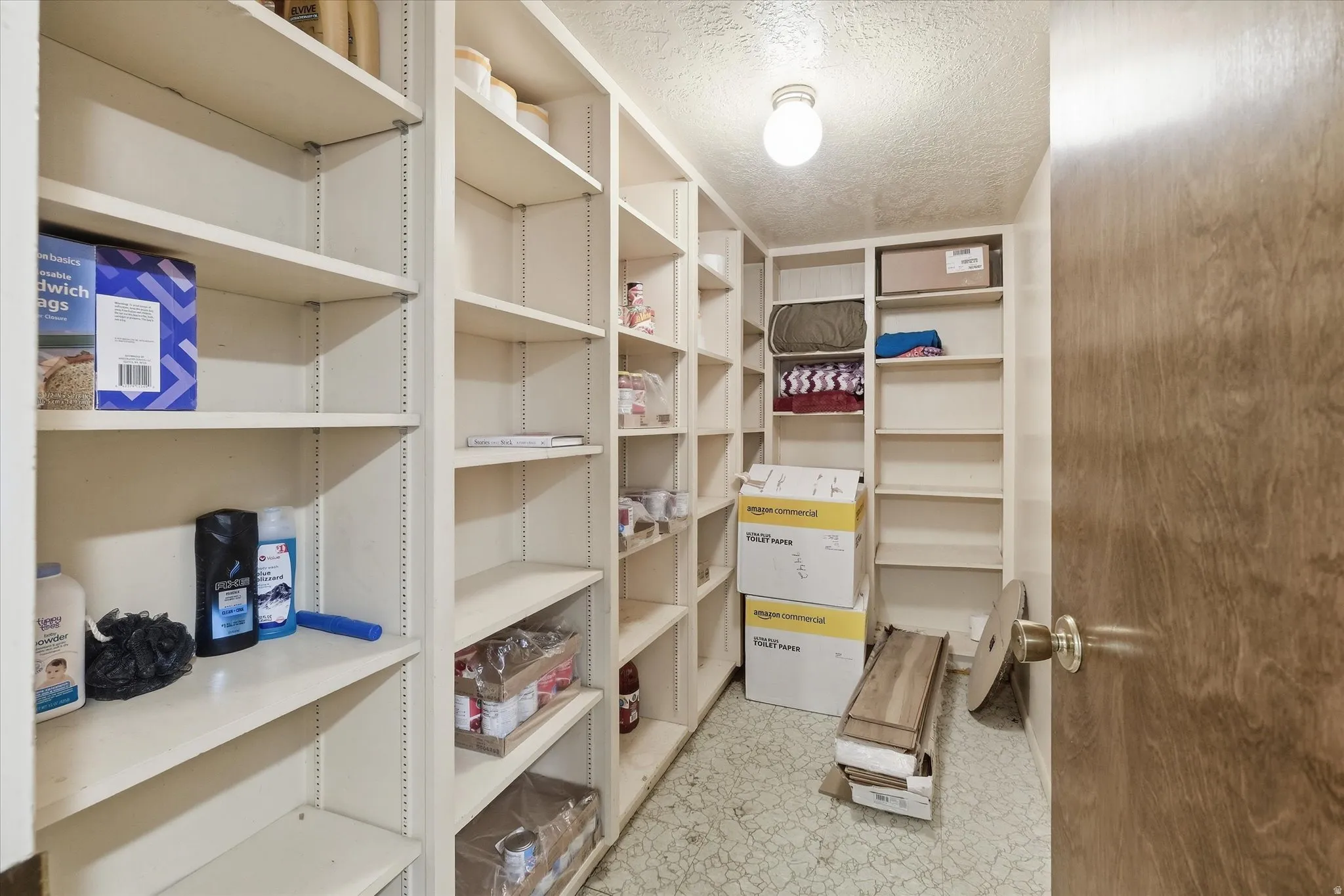 View of storage room wiht built in shelving