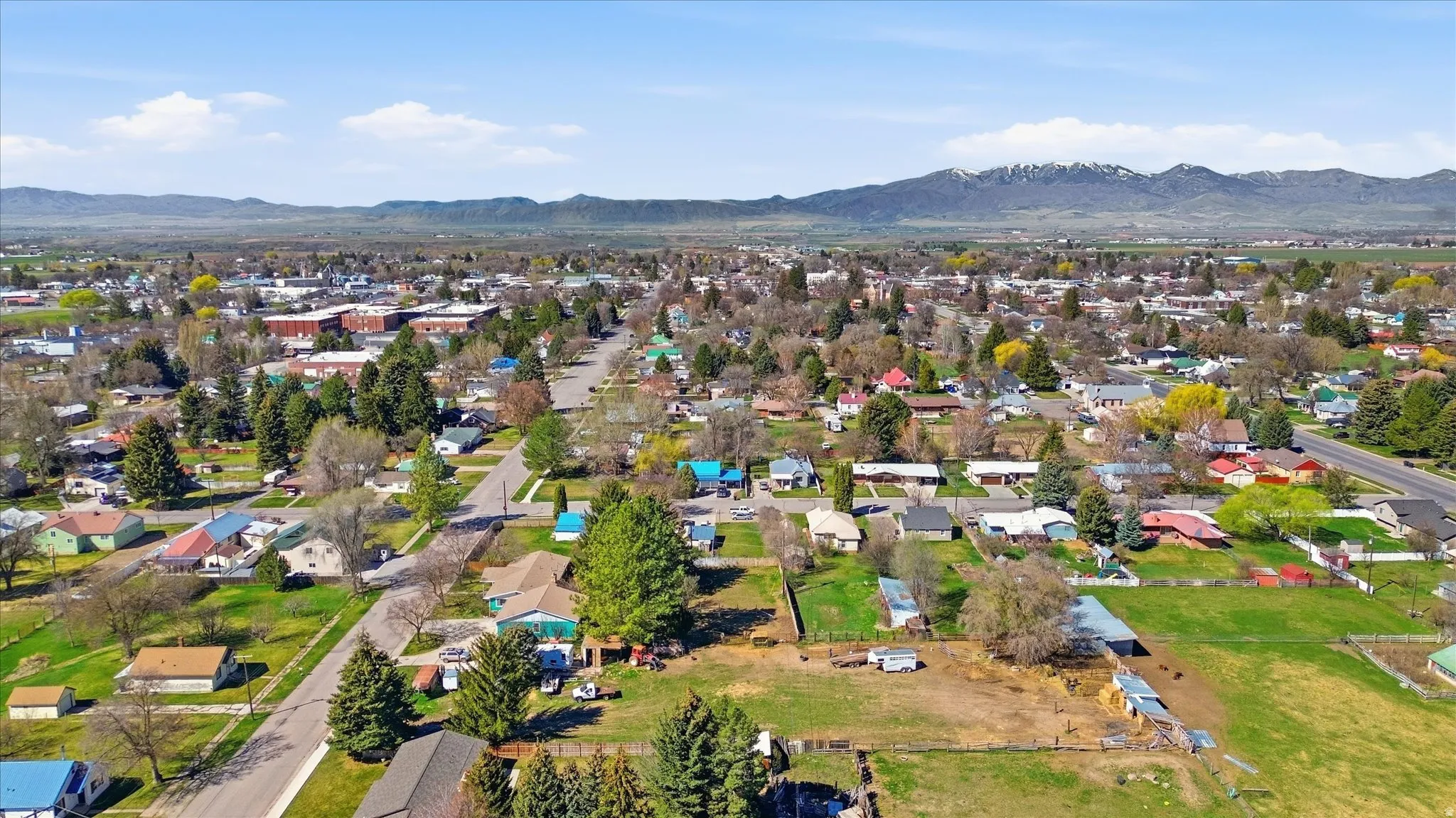 Aerial view of residential area featuring a mountainous background