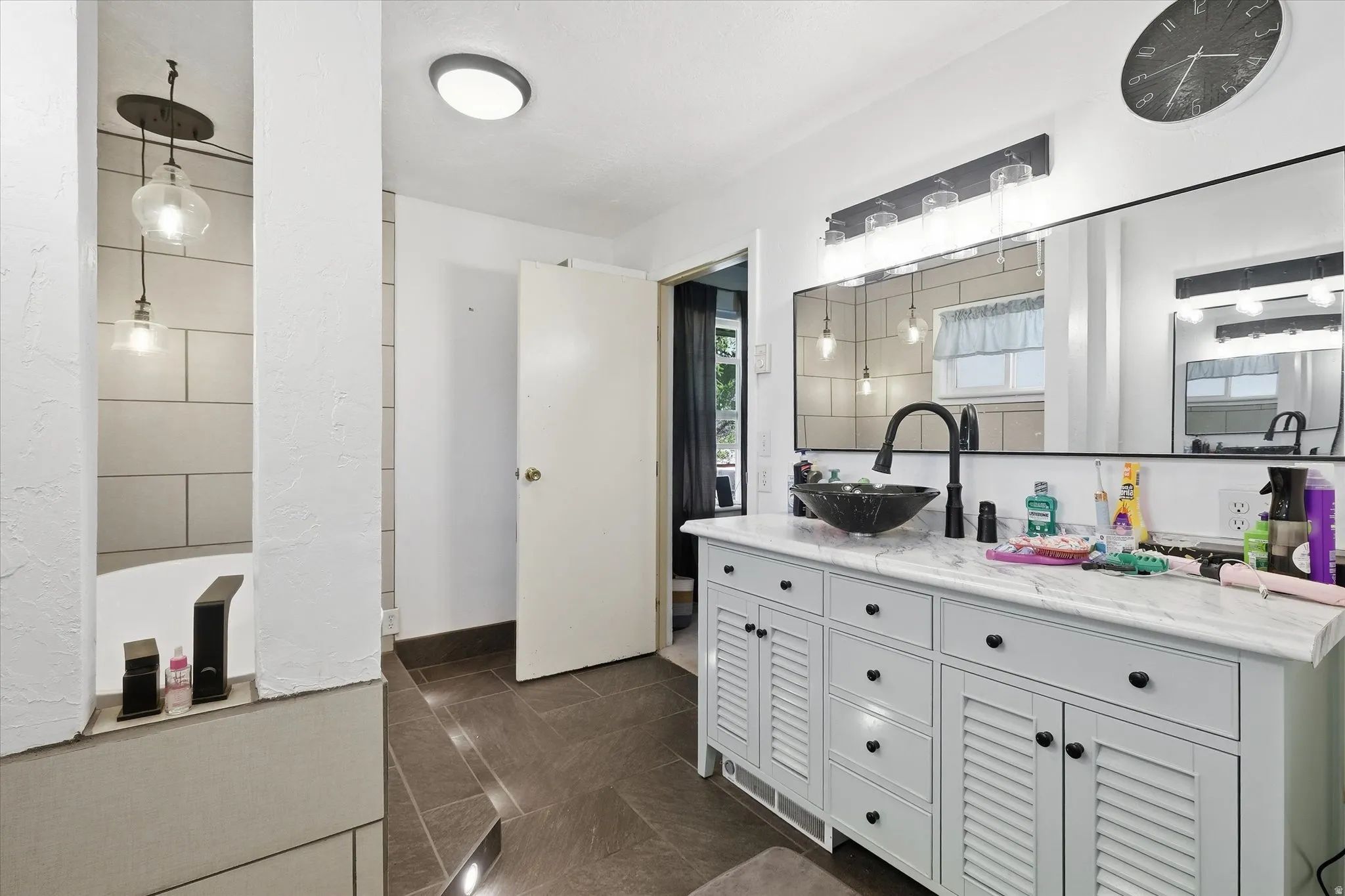 Bathroom with vanity and baseboards
