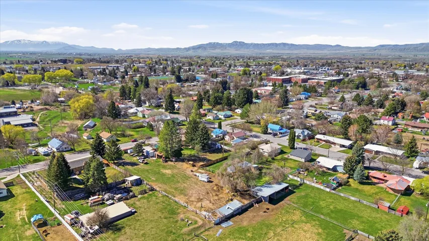 Aerial perspective of suburban area featuring a mountainous background