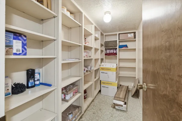 View of storage room wiht built in shelving