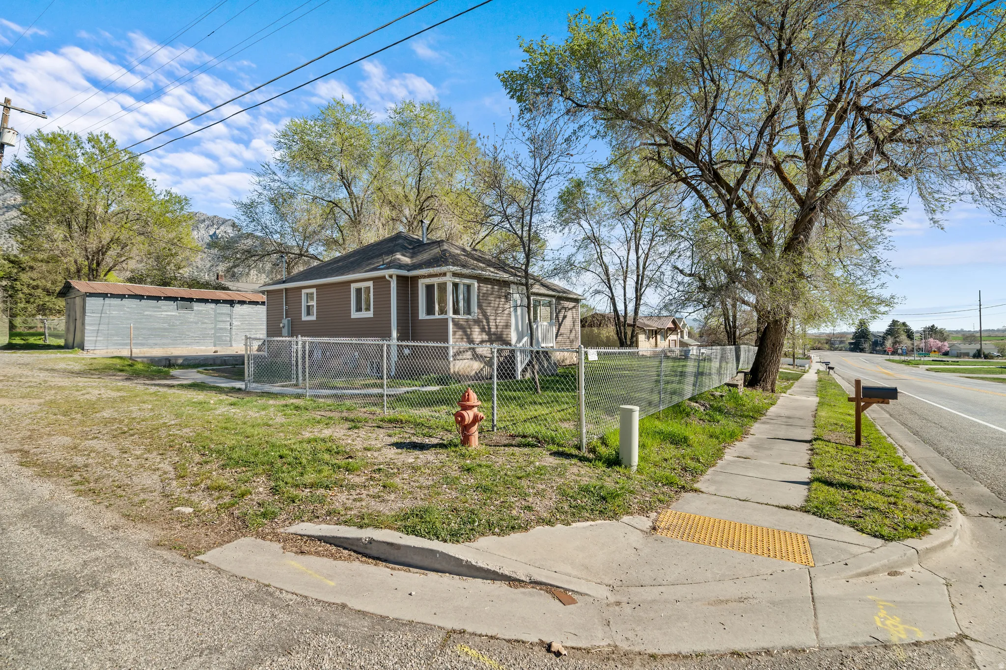 Bungalow-style house with a fenced front yard