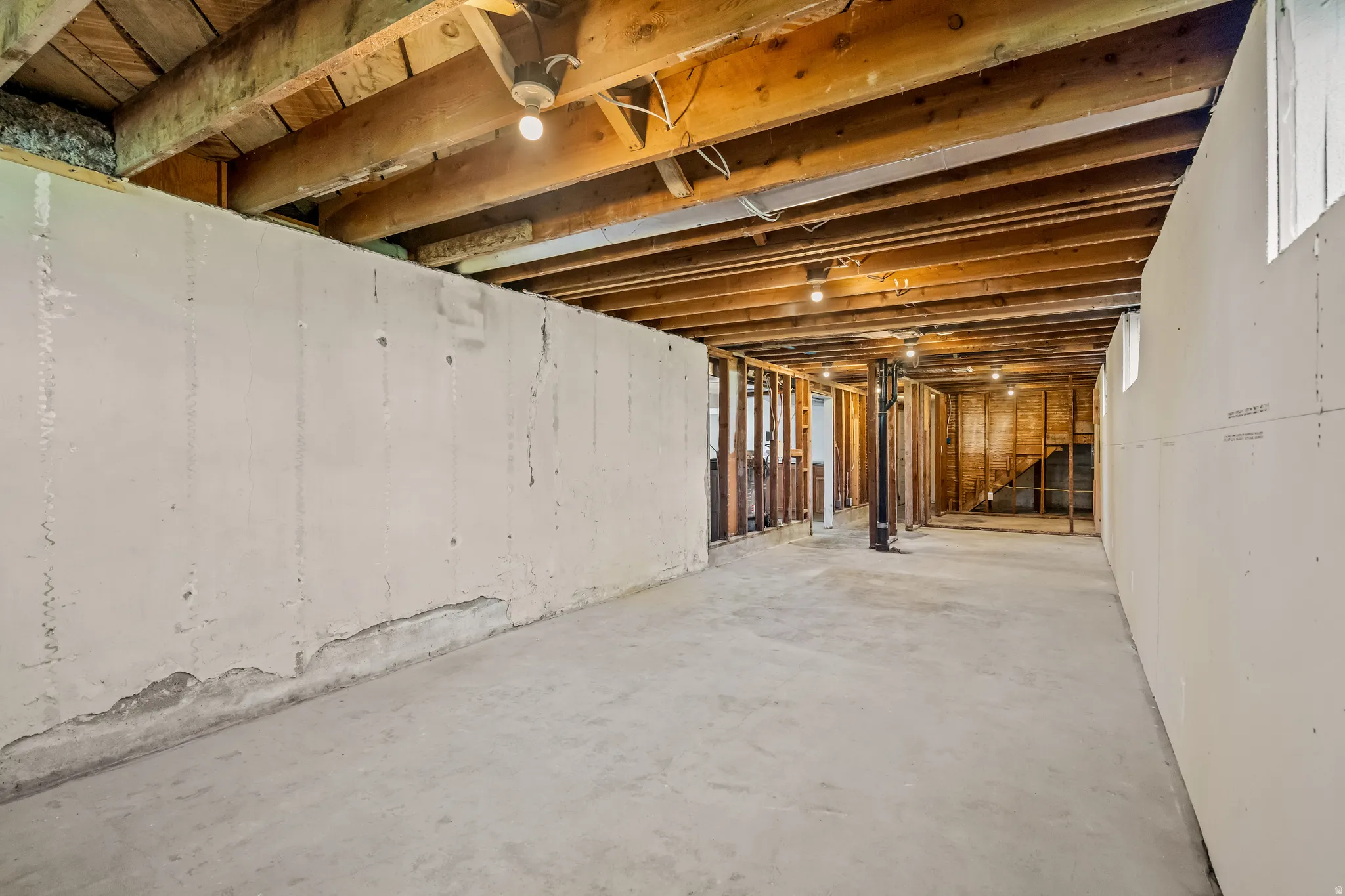 Unfinished basement with stairway