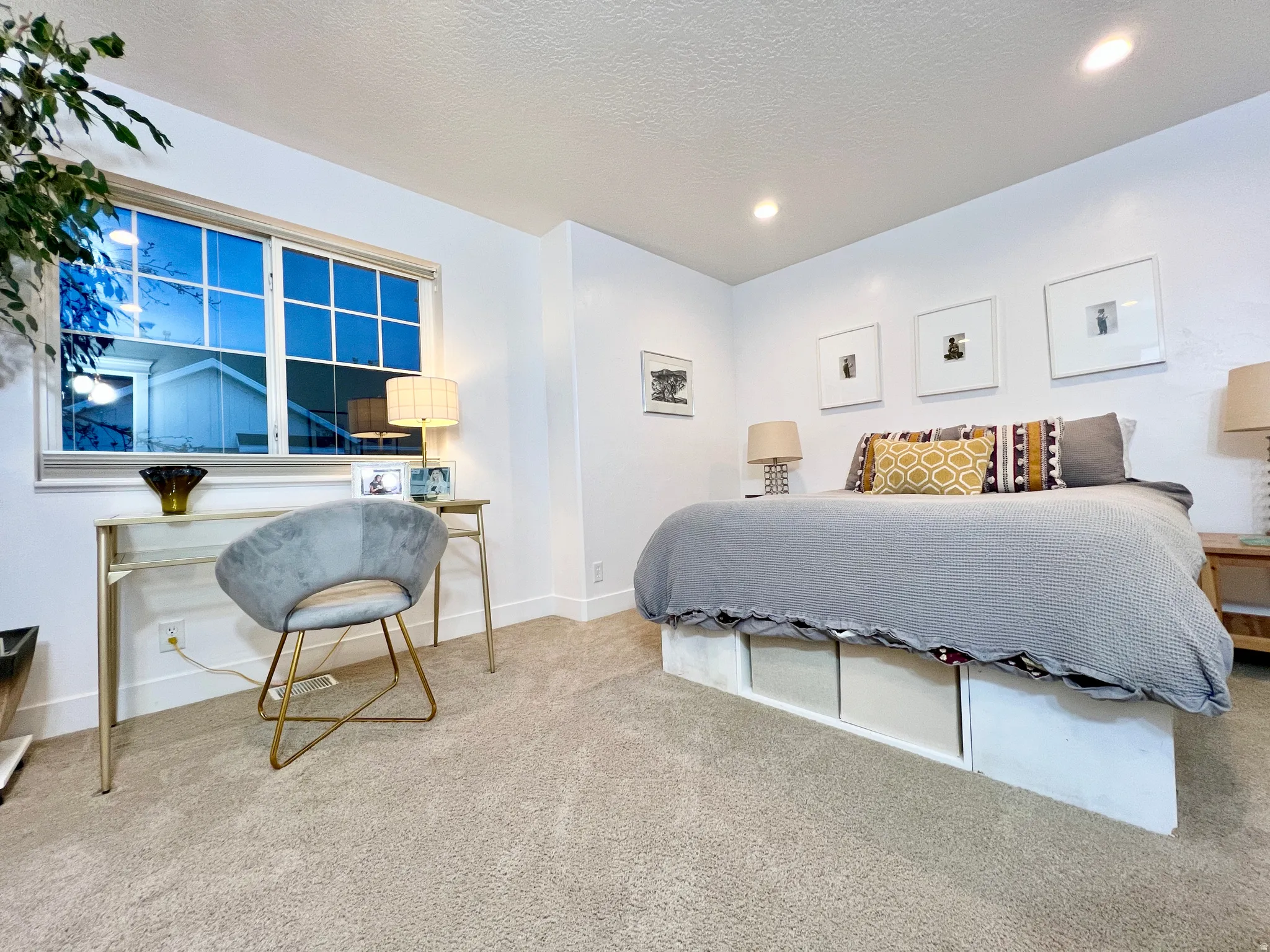 Bedroom with carpet floors and a textured ceiling
