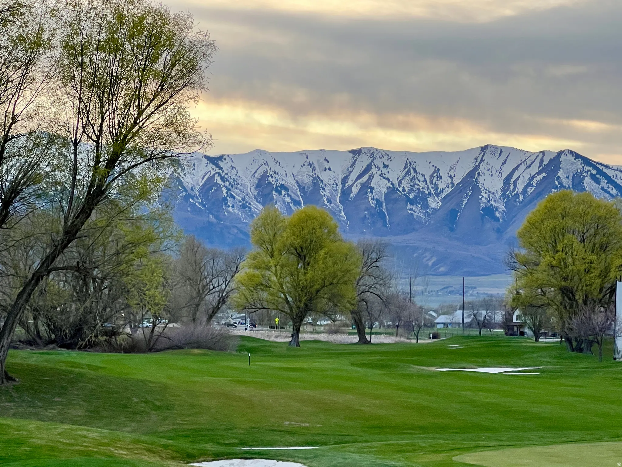 View of community featuring a mountain view and view of golf course