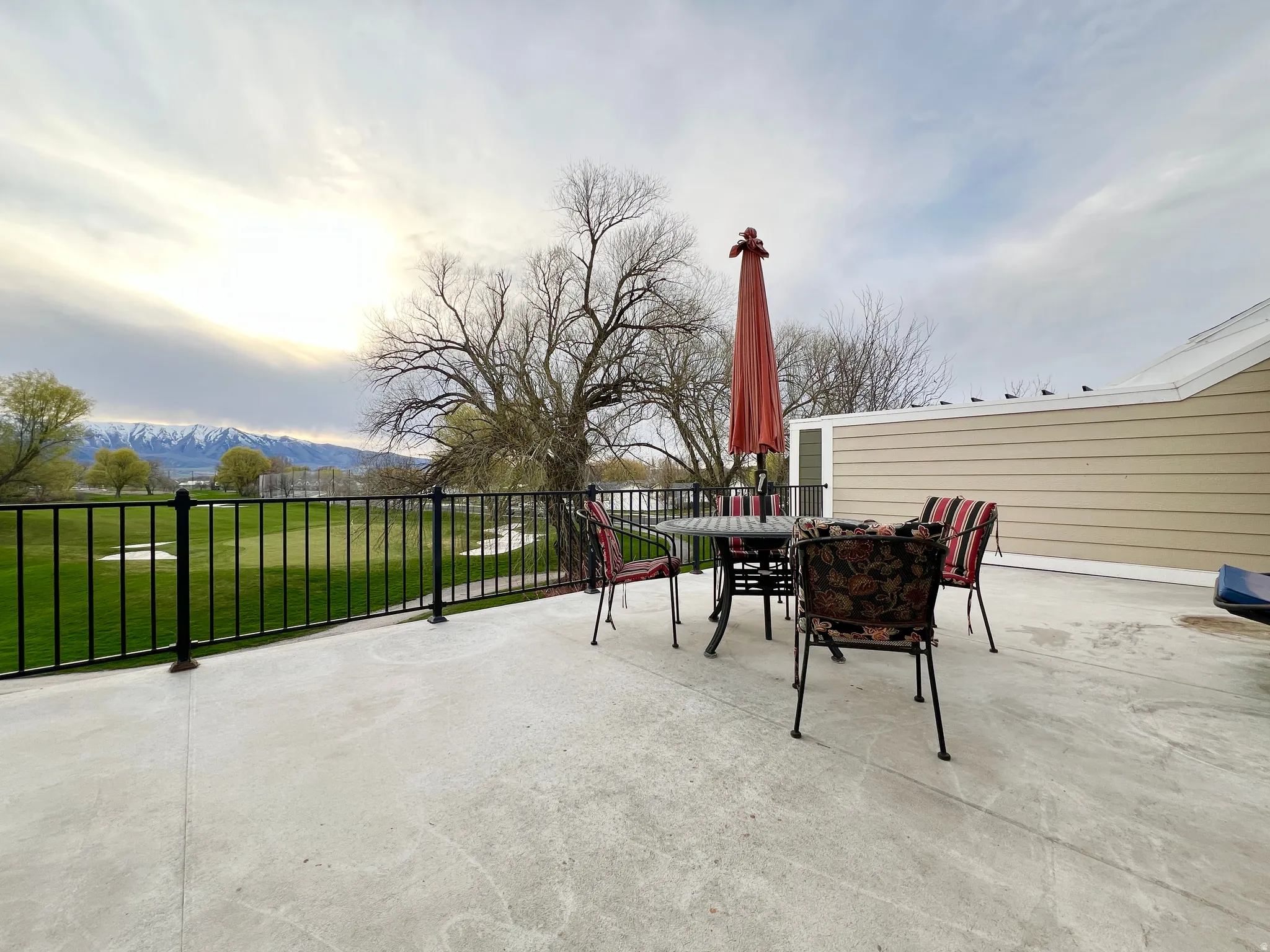 View of patio / terrace featuring outdoor dining area and a mountain view
