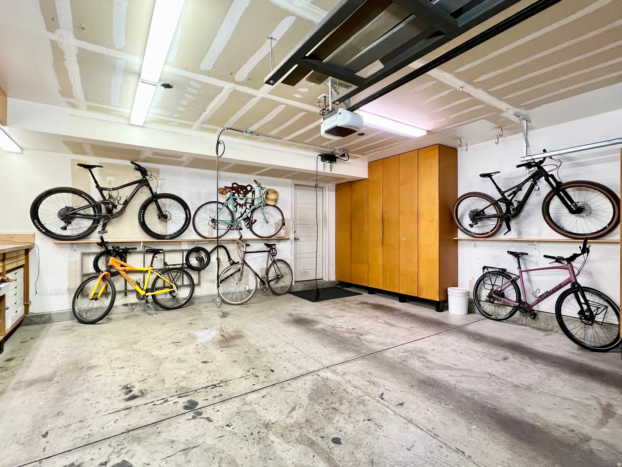 Garage featuring bike storage and a garage door opener