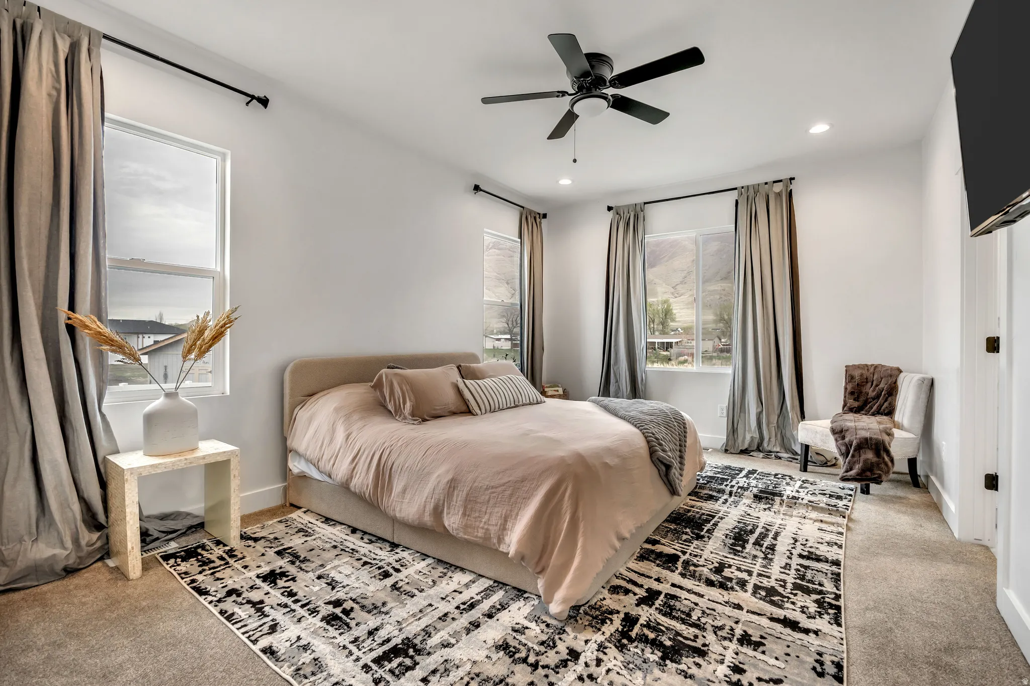 Bedroom with carpet, ceiling fan, and recessed lighting