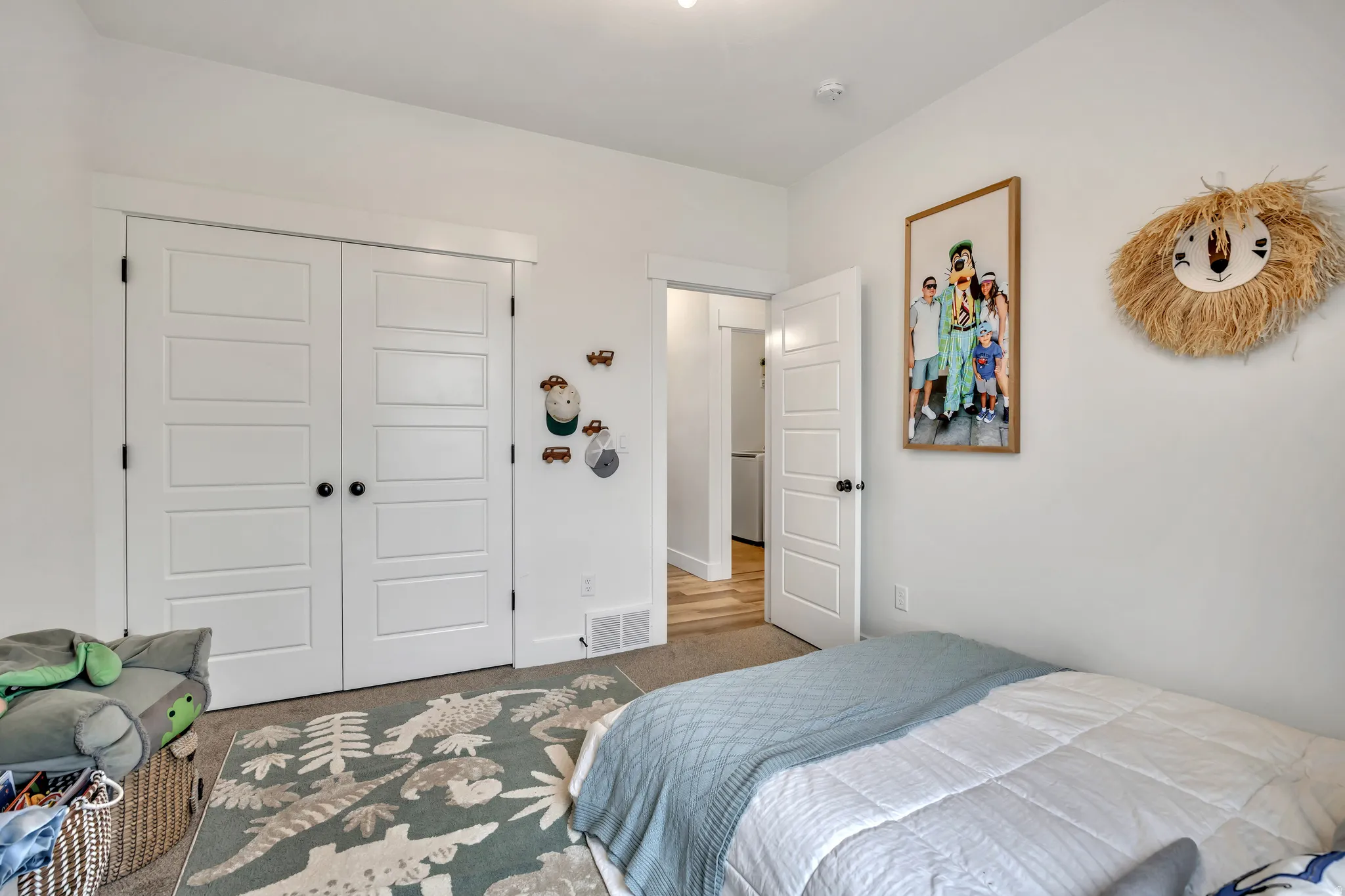 Bedroom with carpet floors and a closet
