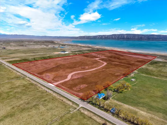 View of property location with property boundaries highlighted and a water and mountain view