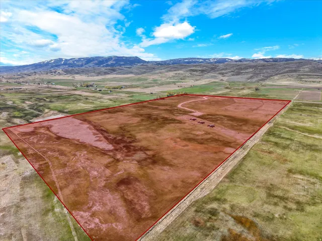 View of rural area with property parcel outlined and mountains