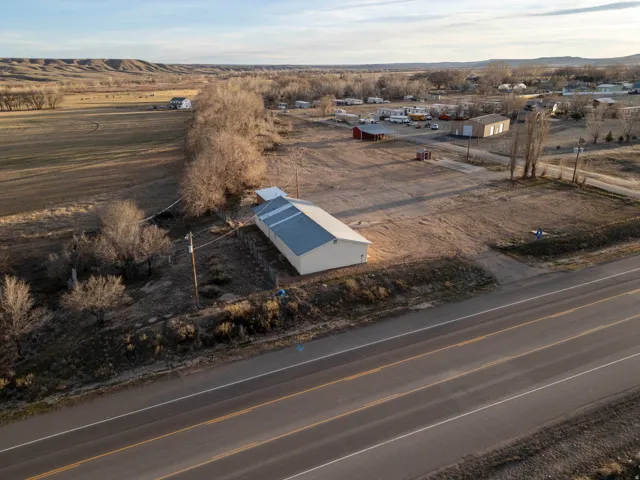 Aerial view of property and surrounding area featuring rural landscape