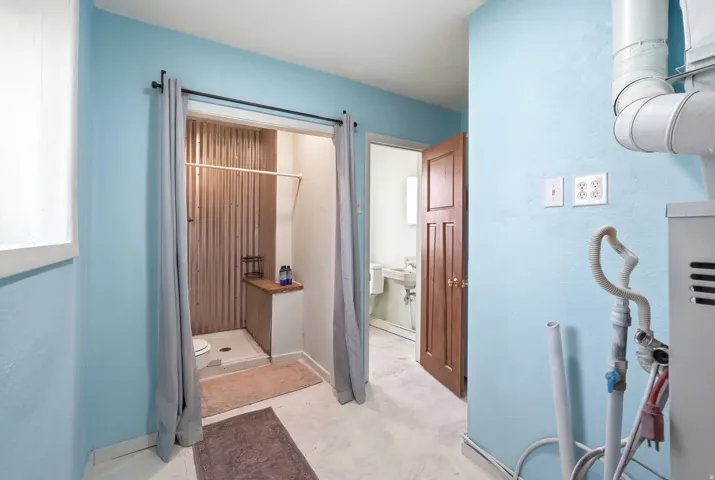 Bathroom with a stall shower and toilet
