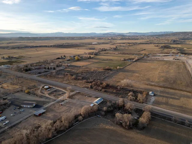 Overview of rural landscape featuring a mountainous background