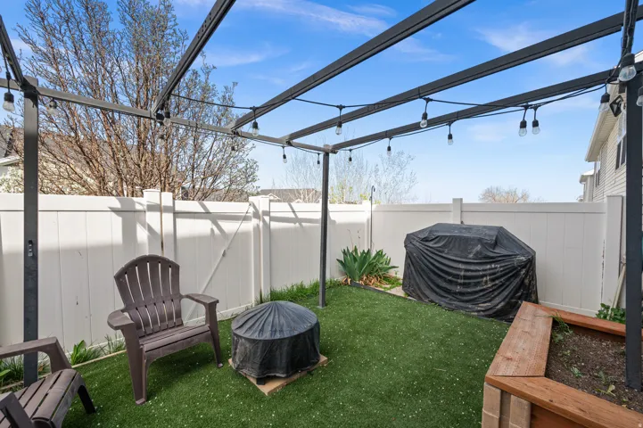 Fenced backyard featuring a patio