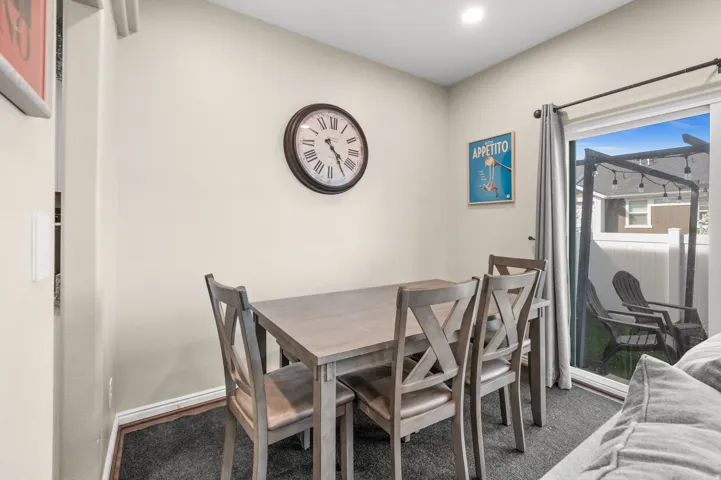Dining area with carpet floors and baseboards