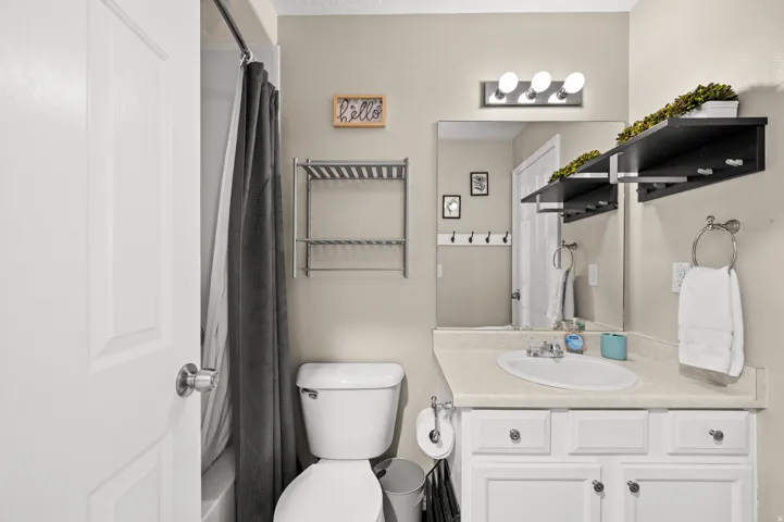 Bathroom with vanity and a shower with curtain