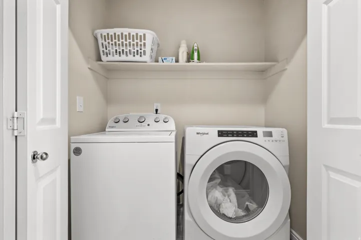 Laundry area with washer and clothes dryer