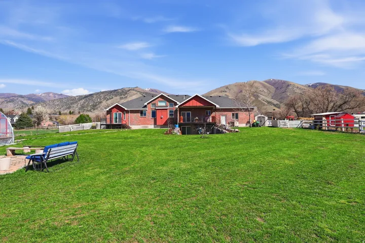 View of yard featuring a mountain view and an outbuilding