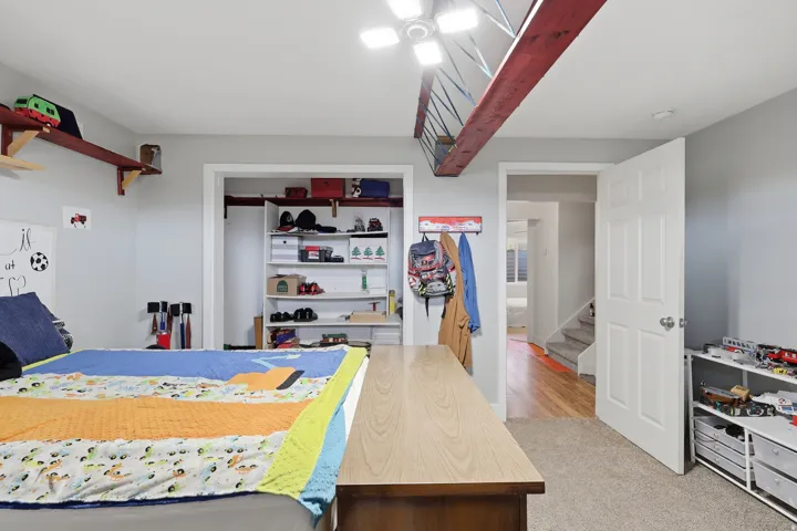 Bedroom with a closet and light carpet