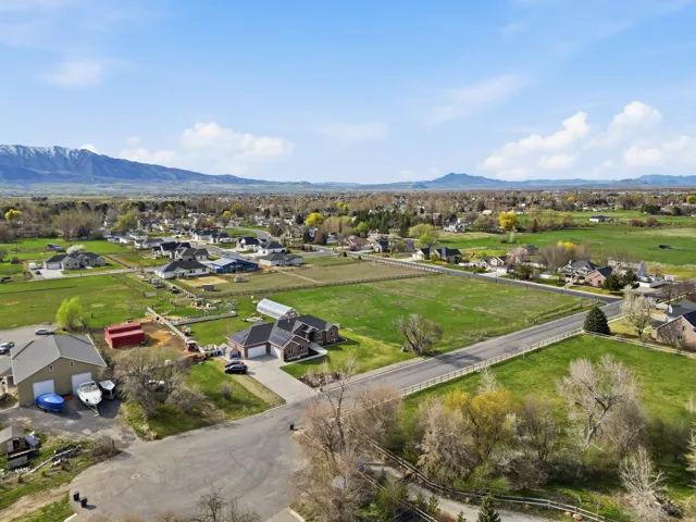 Aerial perspective of suburban area with a mountainous background