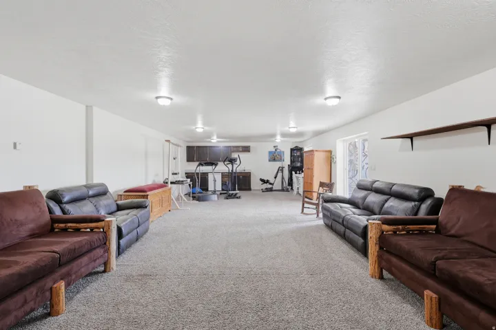 Living room with carpet and a textured ceiling