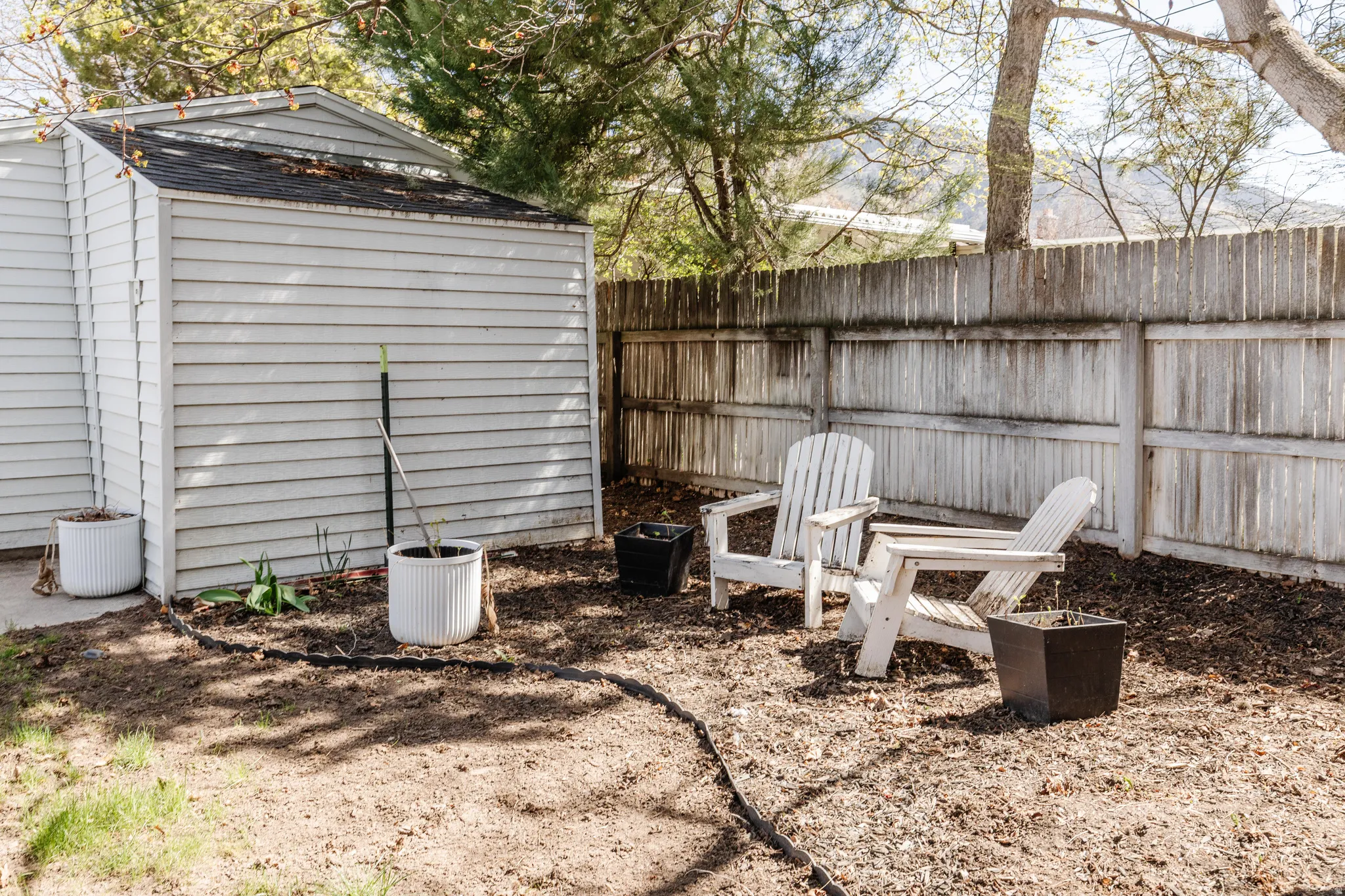 View of fenced backyard