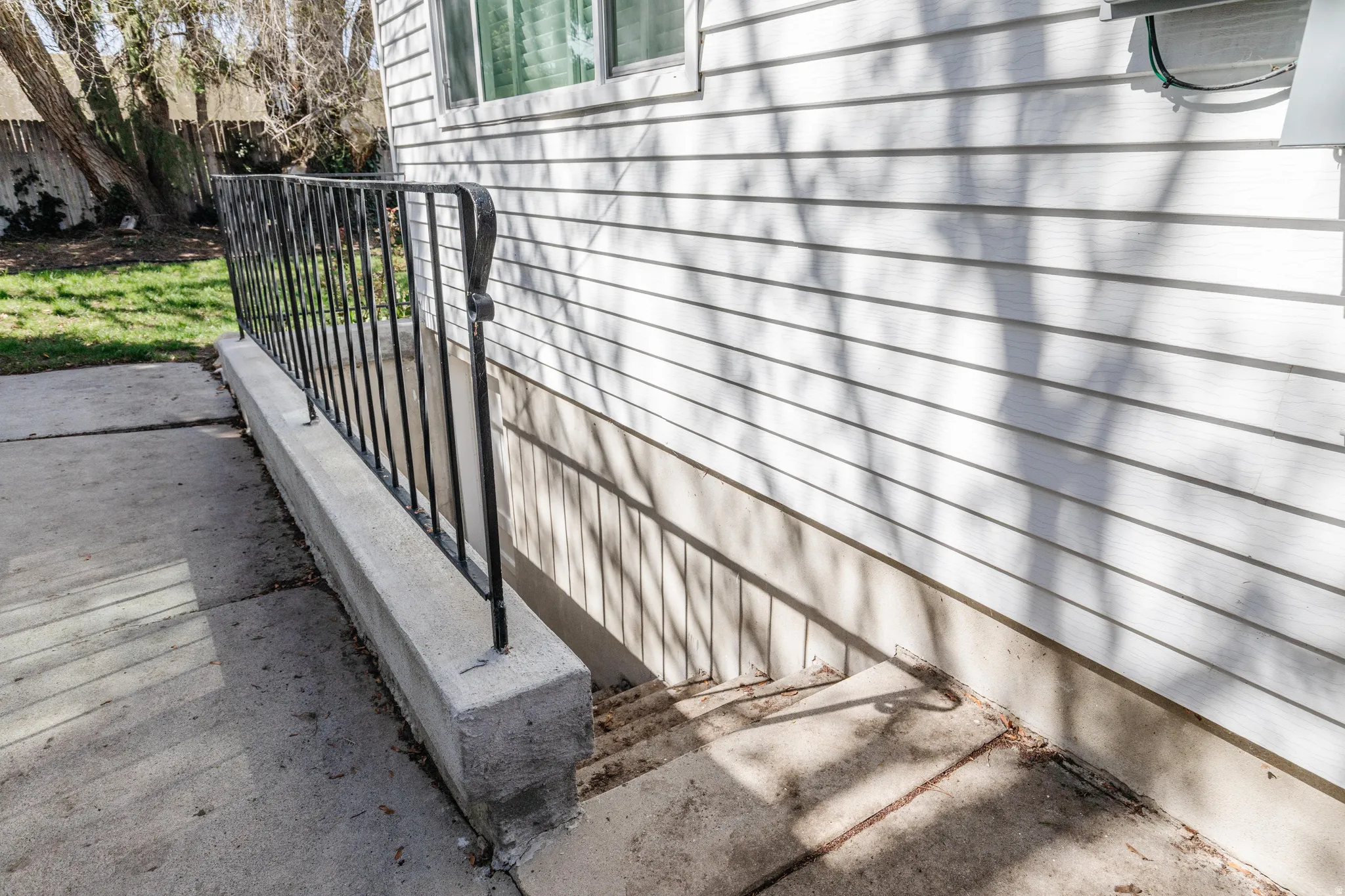 View of stairs to basement from the outdoor walkway