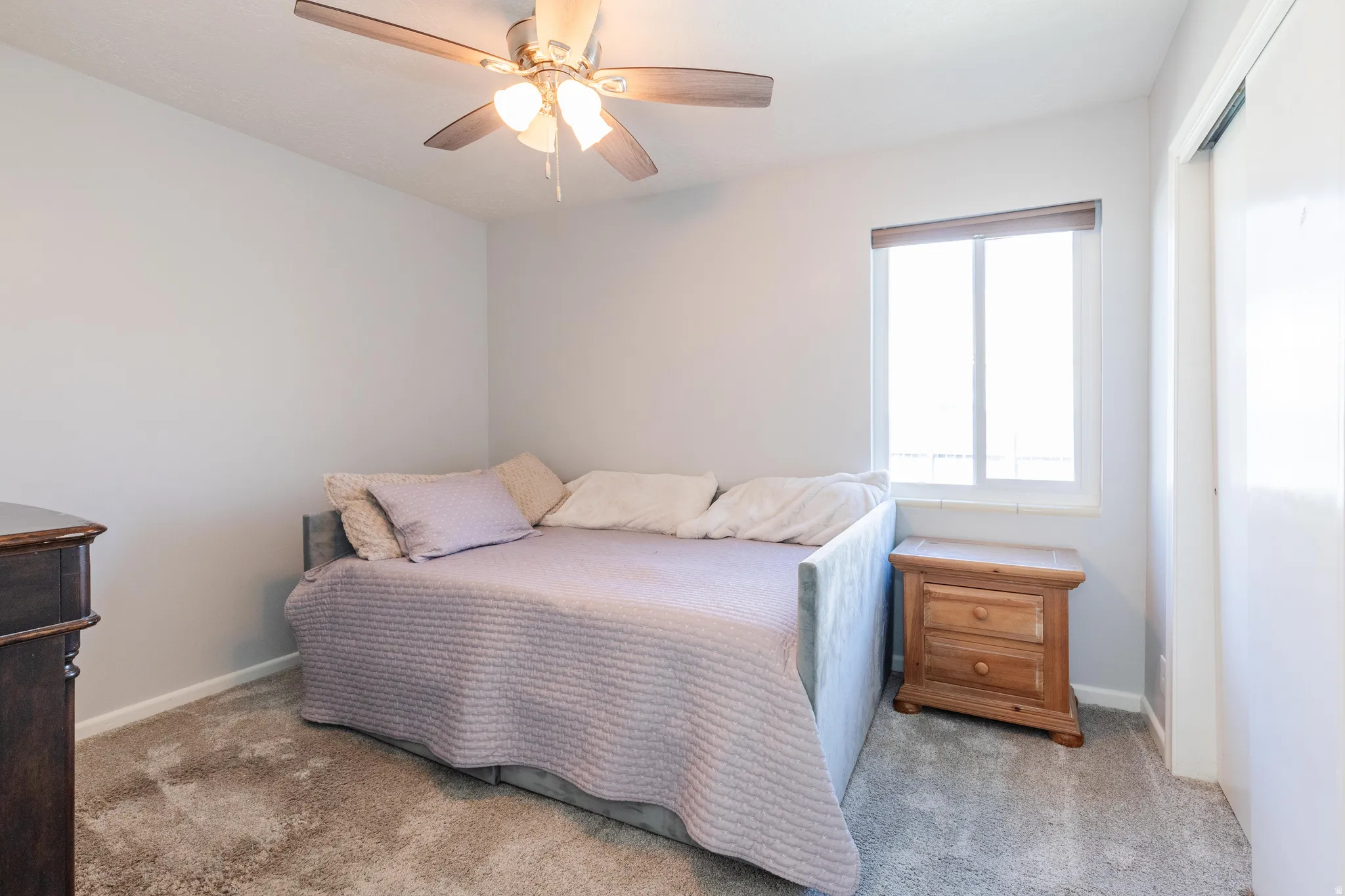 Bedroom 2 featuring a closet and ceiling fan