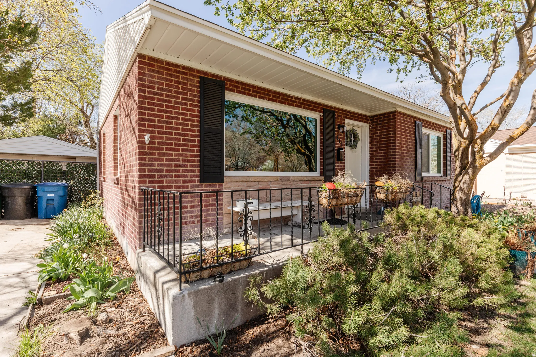 Ranch-style home featuring brick siding and a garage