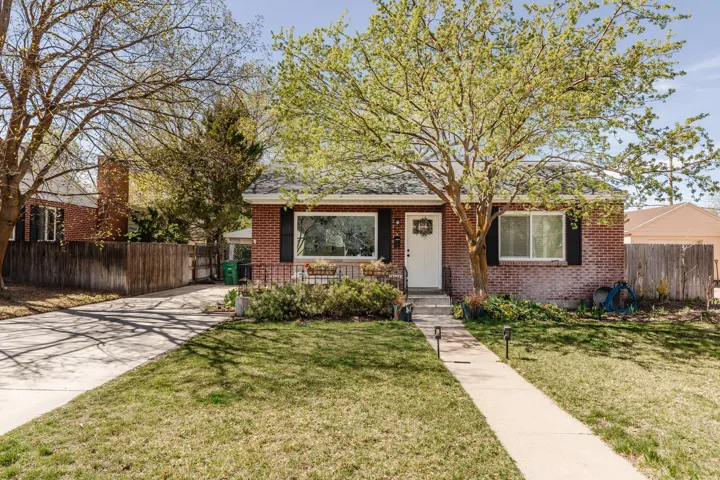 Bungalow-style house featuring brick siding and concrete driveway