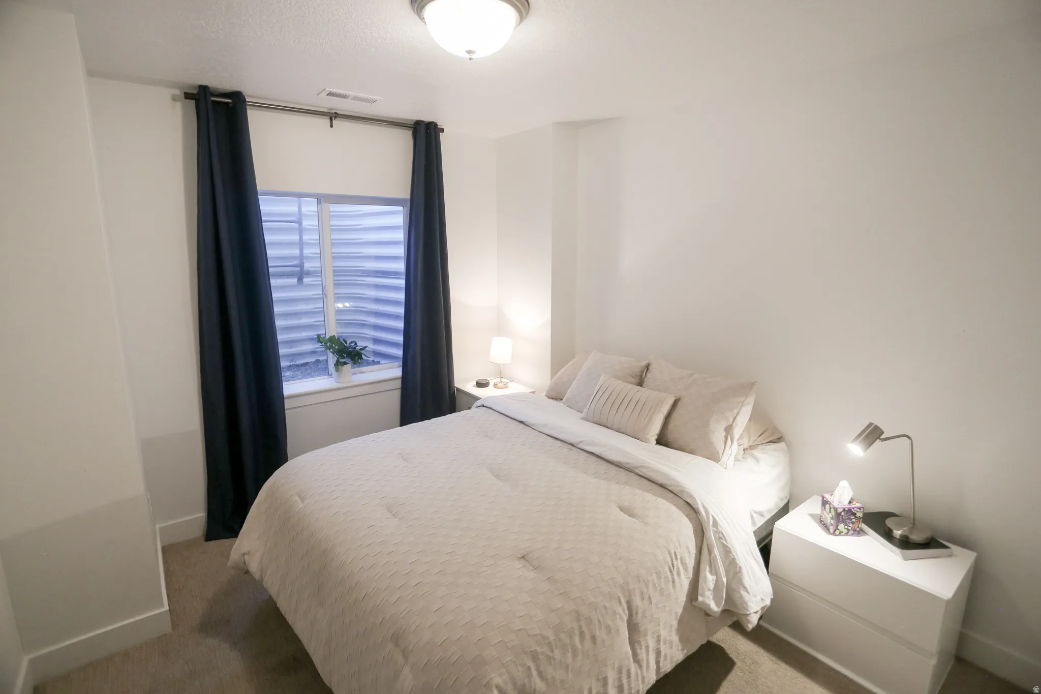 Carpeted bedroom with baseboards