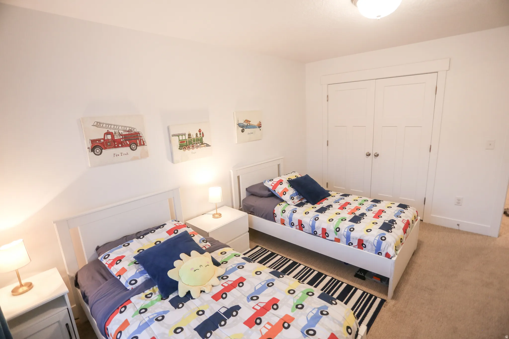 Carpeted bedroom featuring a closet