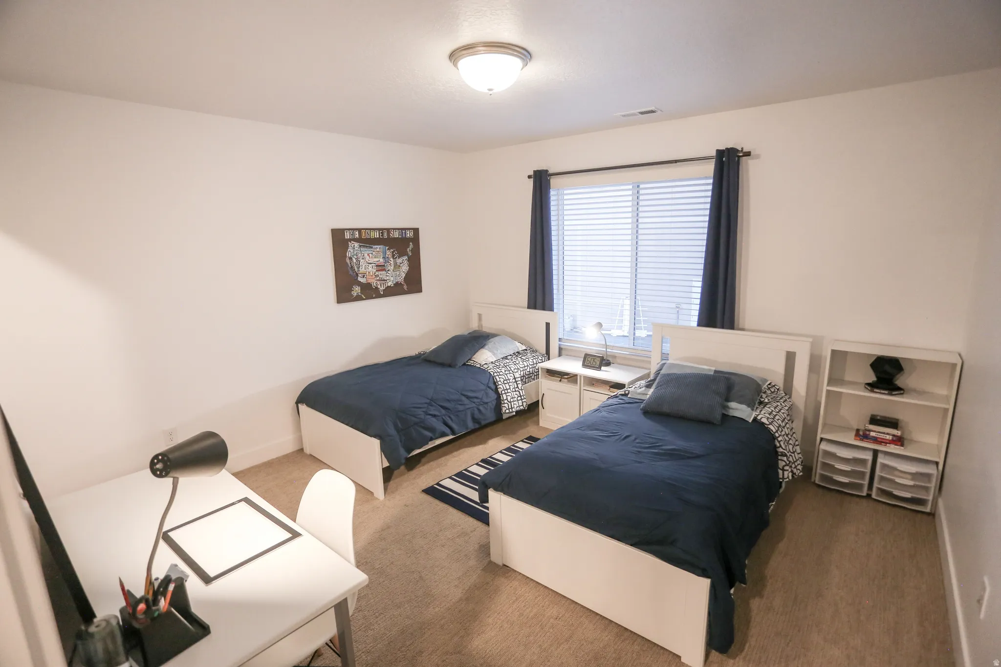 Carpeted bedroom featuring baseboards