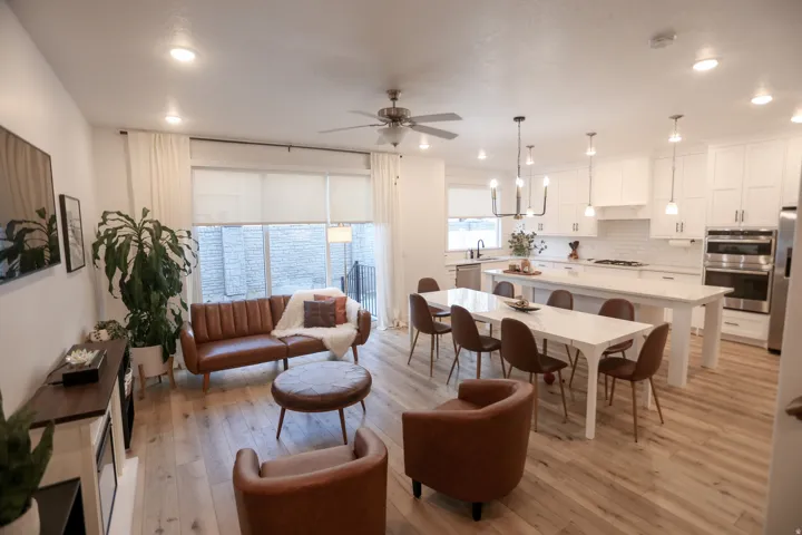 Living area featuring a ceiling fan, light wood-style flooring, and recessed lighting