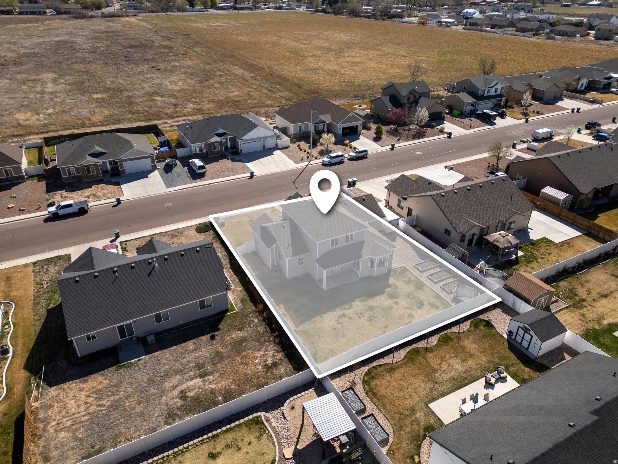 Aerial view of property's location featuring nearby suburban area