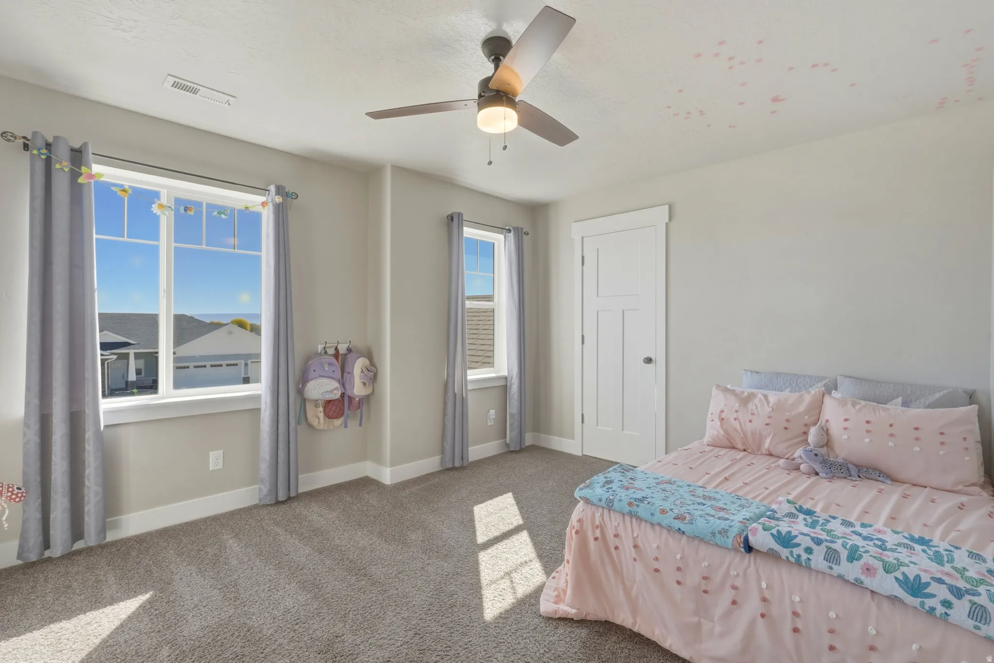 Bedroom featuring carpet flooring and ceiling fan