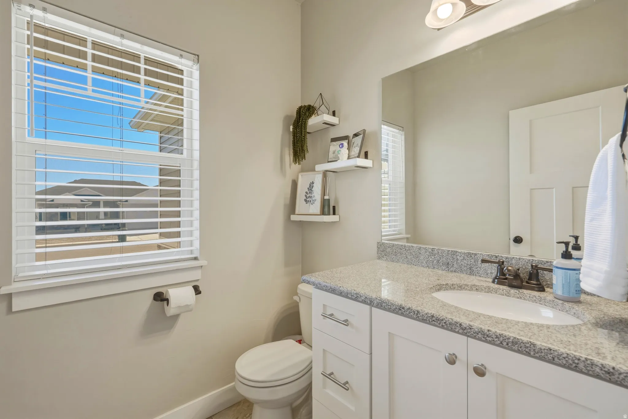 Half bath with vanity and toilet