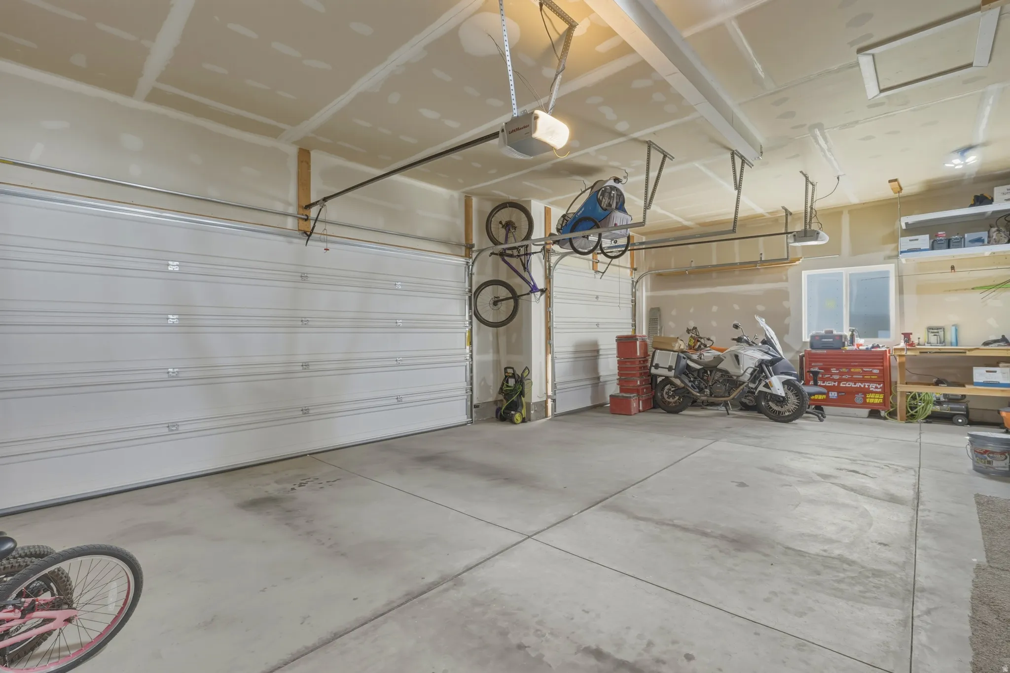 Garage featuring a garage door opener