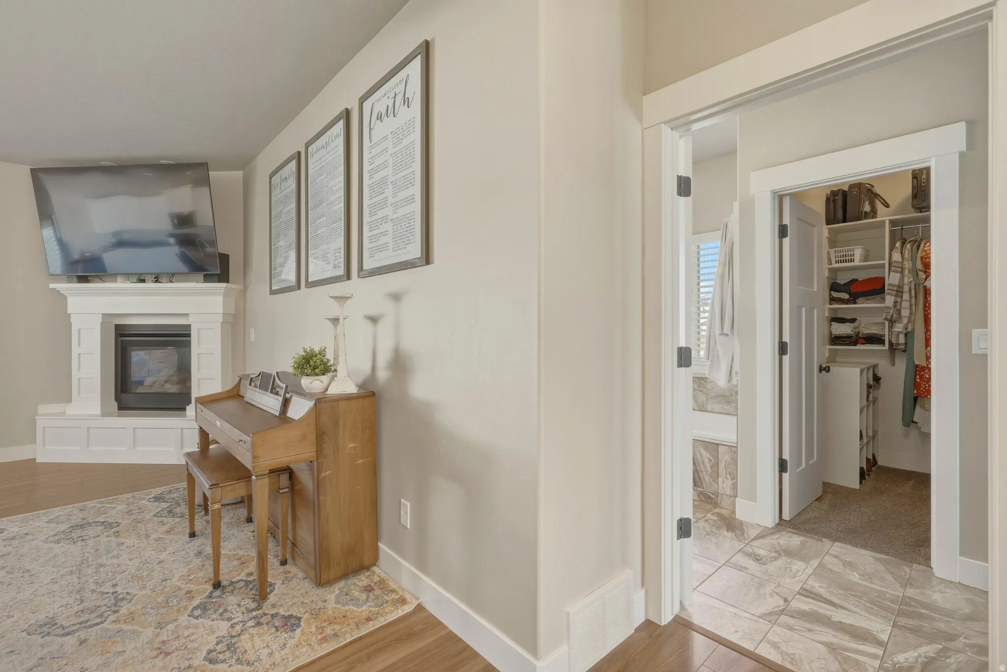 Hall with baseboards and light wood finished floors