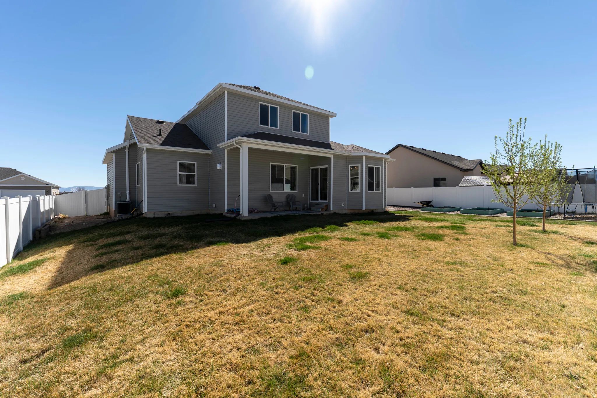 Back of house with a patio and a fenced backyard