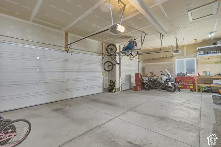 Garage featuring a garage door opener
