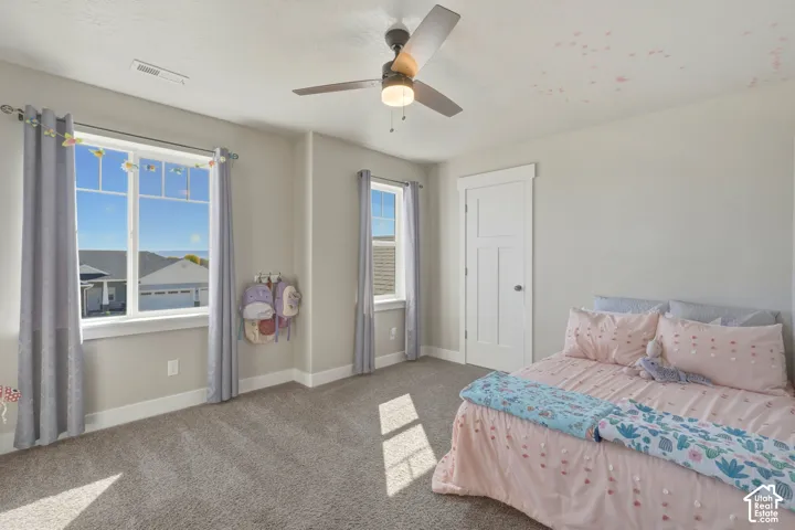 Bedroom featuring carpet flooring and ceiling fan