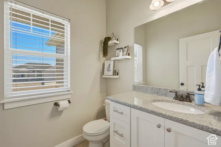 Half bath with vanity and toilet