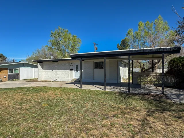 Rear view of house with brick siding