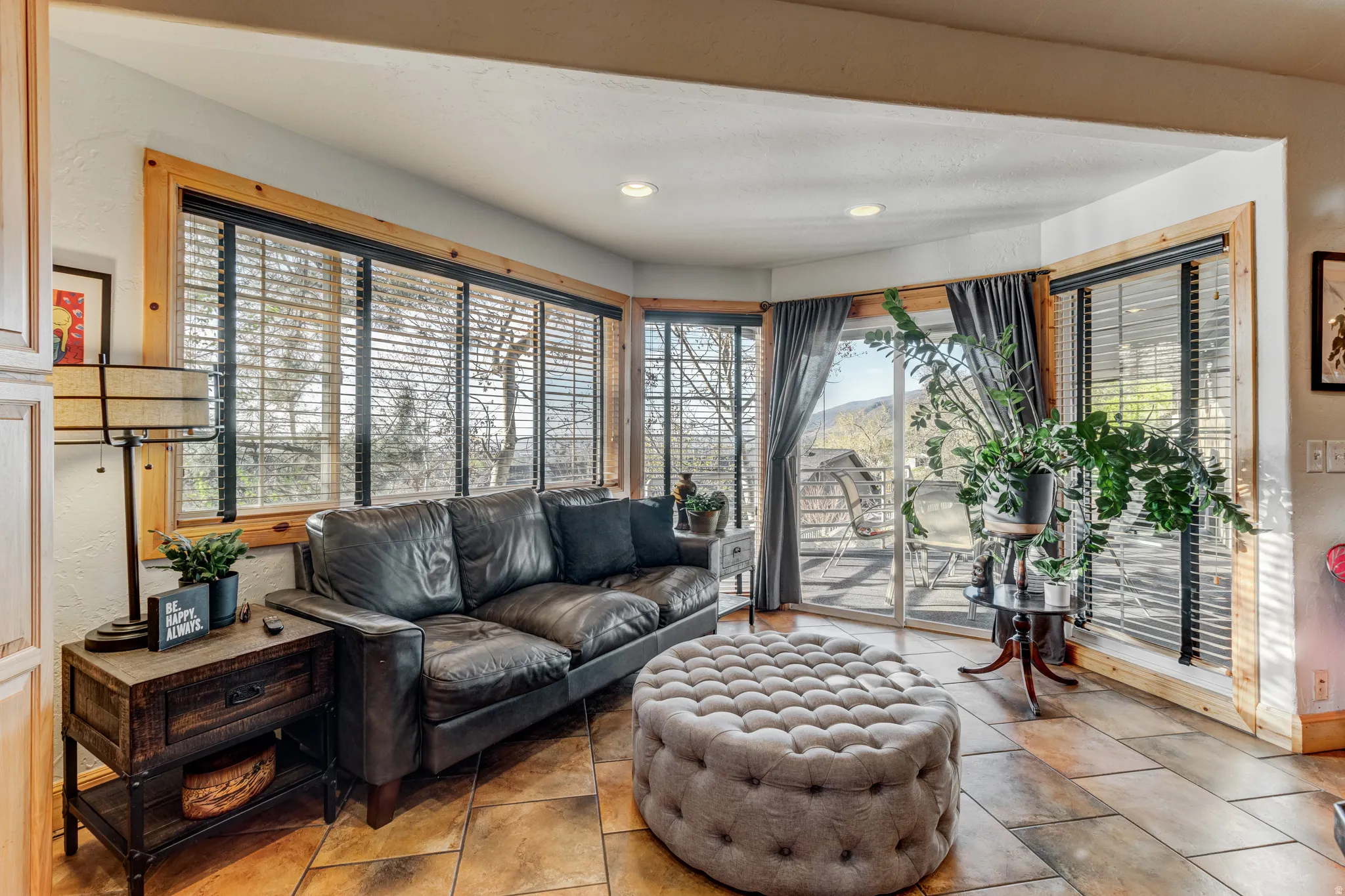 Living area with recessed lighting and baseboards